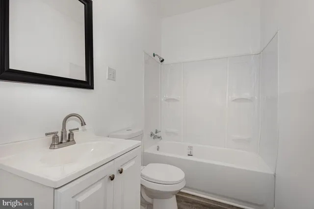 a bathroom with a sink toilet and a bathtub