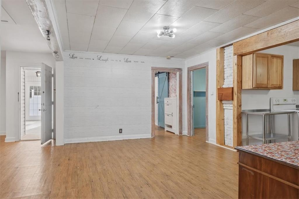 1491 Booze Mountain Road Silver Creek, GA 30173 - Photo 12 of 41 wooden floor in an empty room with a window