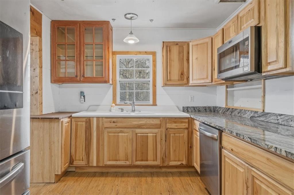 1491 Booze Mountain Road Silver Creek, GA 30173 - Photo 14 of 41 a kitchen with stainless steel appliances granite countertop a stove and a sink