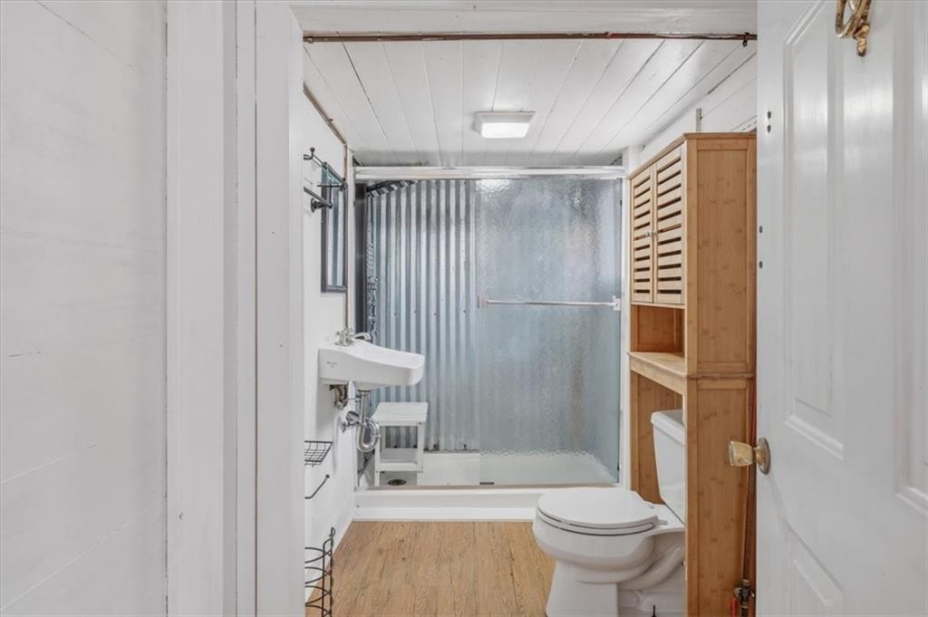 1491 Booze Mountain Road Silver Creek, GA 30173 - Photo 17 of 41 a bathroom with a sink and a toilet