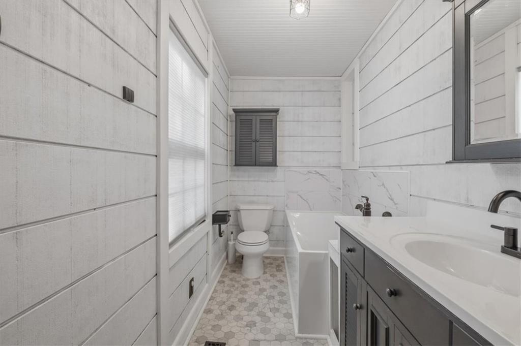 1491 Booze Mountain Road Silver Creek, GA 30173 - Photo 20 of 41 a bathroom with a sink and toilet