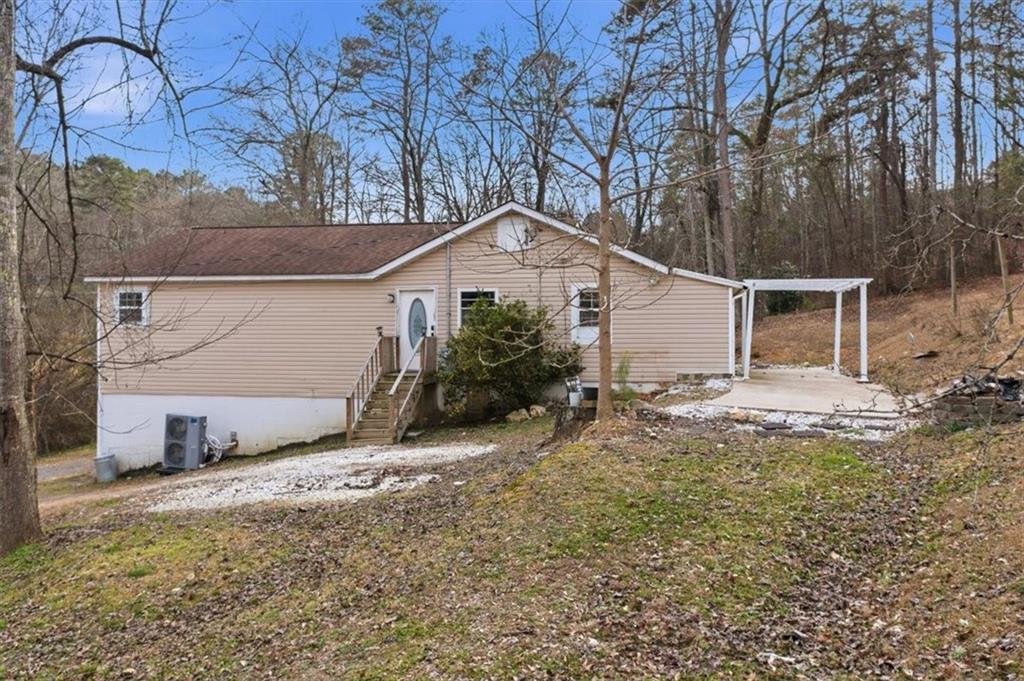 1491 Booze Mountain Road Silver Creek, GA 30173 - Photo 29 of 41 a view of a house with a yard