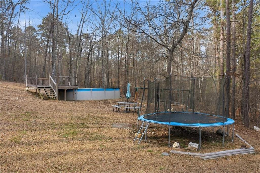1491 Booze Mountain Road Silver Creek, GA 30173 - Photo 32 of 41 a view of a backyard with table and chairs