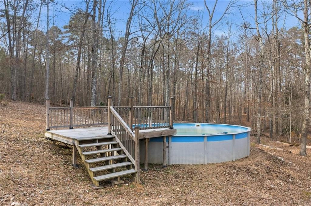 1491 Booze Mountain Road Silver Creek, GA 30173 - Photo 33 of 41 a view of a backyard with sitting area