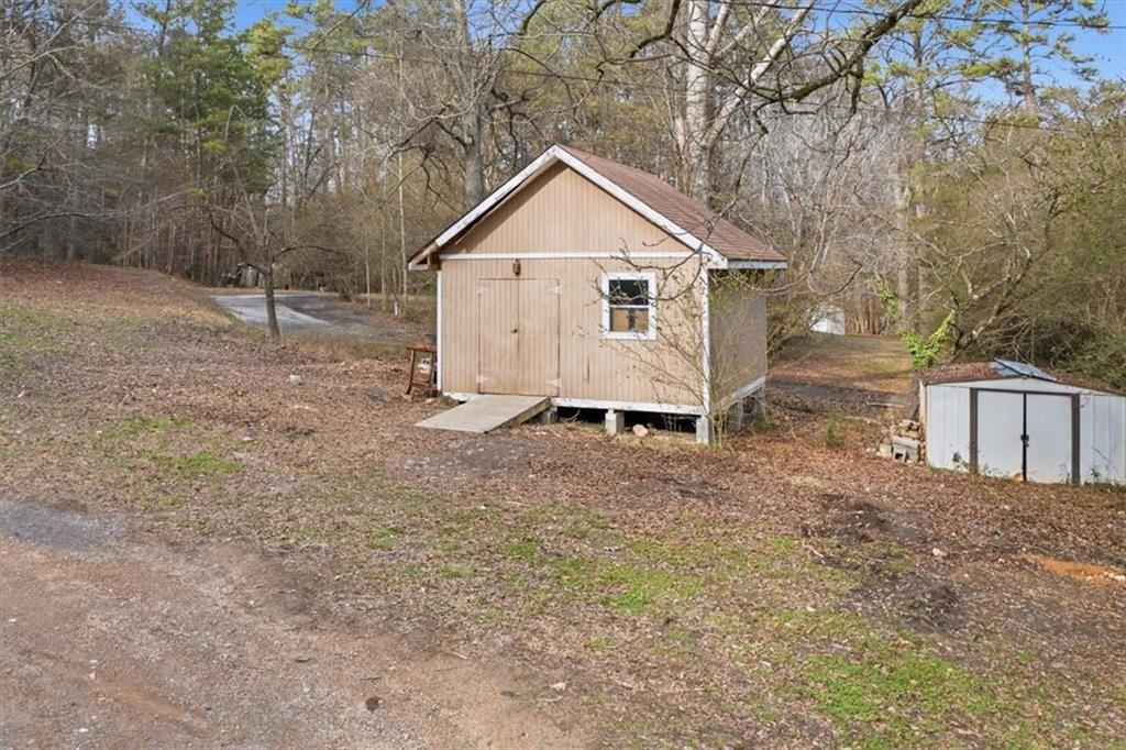 1491 Booze Mountain Road Silver Creek, GA 30173 - Photo 35 of 41 a view of a house with backyard