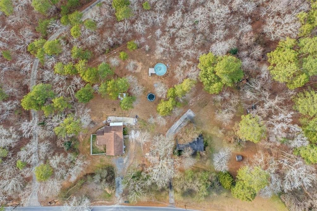1491 Booze Mountain Road Silver Creek, GA 30173 - Photo 38 of 41 a backyard of a house with a yard and outdoor seating