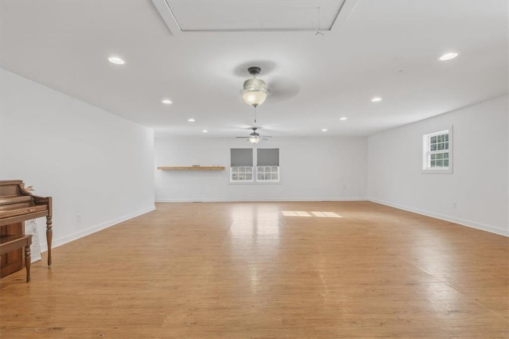 1491 Booze Mountain Road Silver Creek, GA 30173 - Photo 5 of 41 a view of empty room with wooden floor and ceiling fan
