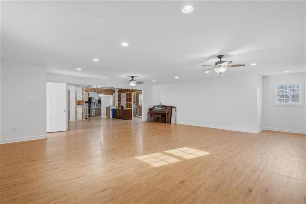 1491 Booze Mountain Road Silver Creek, GA 30173 - Photo 7 of 41 a view of an empty room with wooden floor