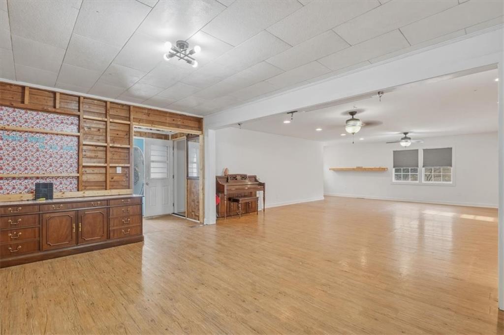 1491 Booze Mountain Road Silver Creek, GA 30173 - Photo 9 of 41 a view of a kitchen with a sink and a refrigerator