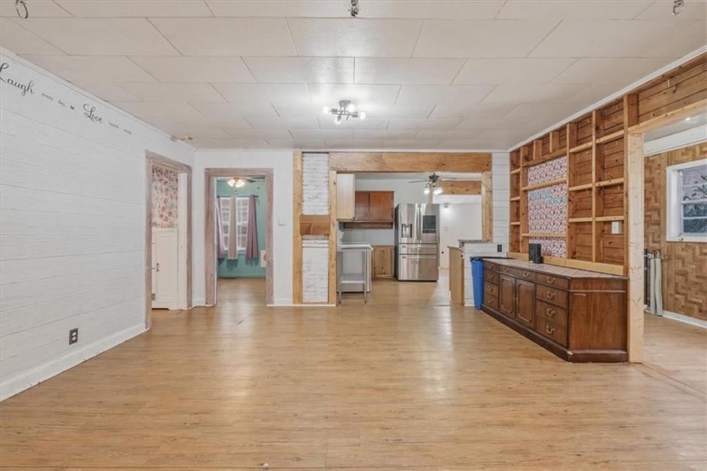 1491 Booze Mountain Road Silver Creek, GA 30173 - Photo 10 of 41 a living room with furniture and kitchen view