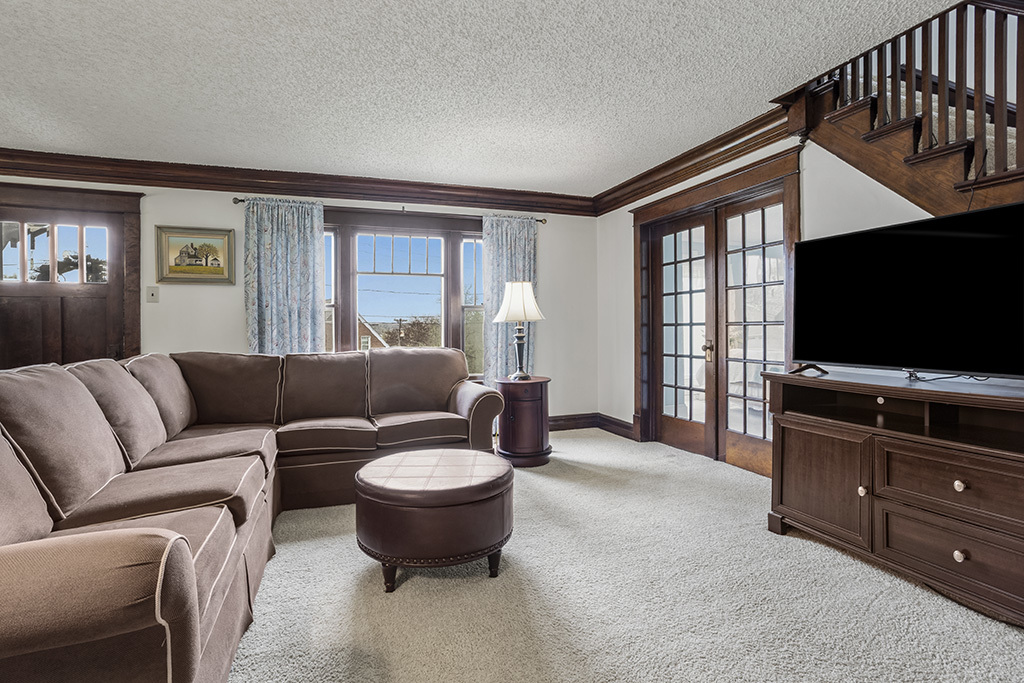 302 East Division Street Lemont, IL 60439 - Photo 13 of 26 a living room with furniture a flat screen tv and a window