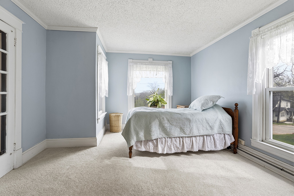 302 East Division Street Lemont, IL 60439 - Photo 18 of 26 a bedroom with a bed and window
