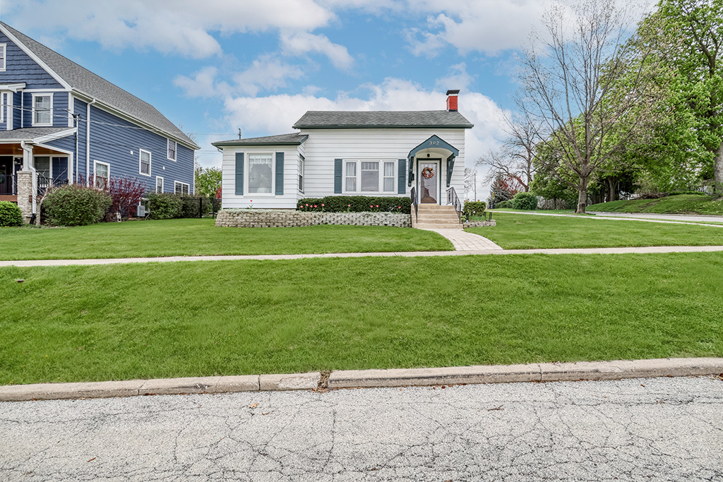 302 East Division Street Lemont, IL 60439 - Photo 2 of 26 a view of house with a big yard and large trees