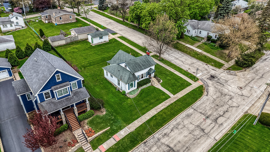 302 East Division Street Lemont, IL 60439 - Photo 23 of 26 an aerial view of a house with a garden and swimming pool