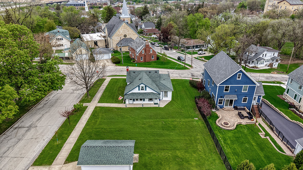302 East Division Street Lemont, IL 60439 - Photo 5 of 26 an aerial view of a house with swimming pool patio and outdoor seating