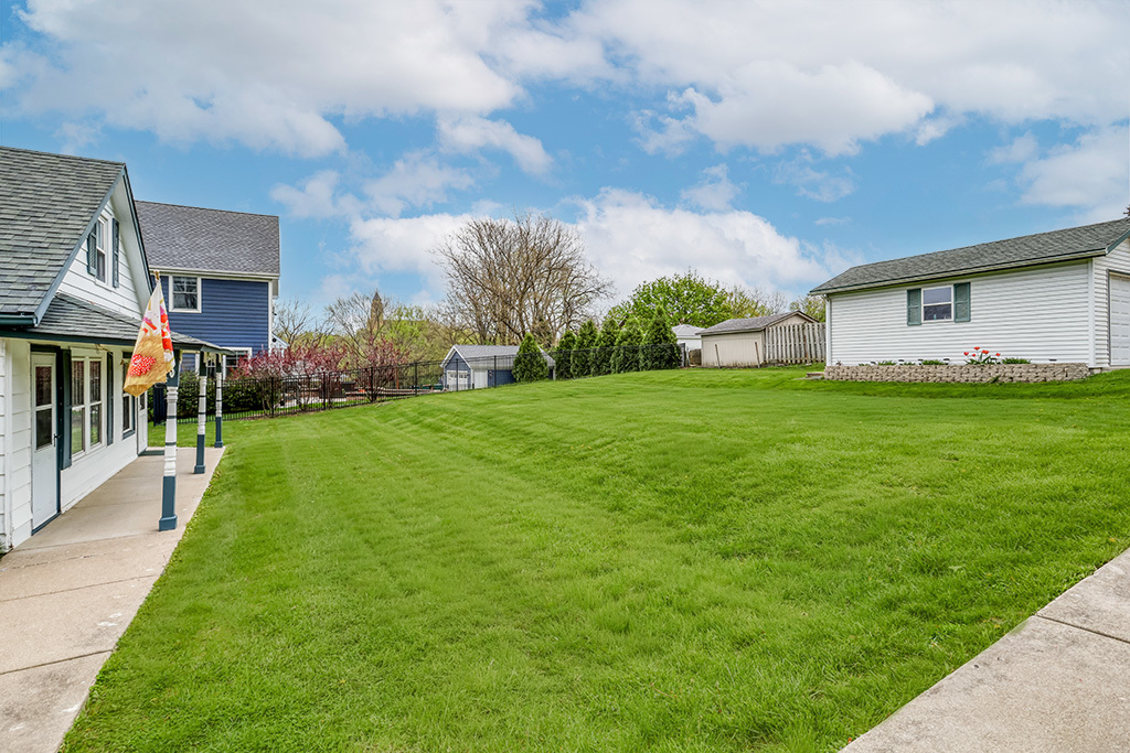 302 East Division Street Lemont, IL 60439 - Photo 9 of 26 a view of a yard with a house in the background