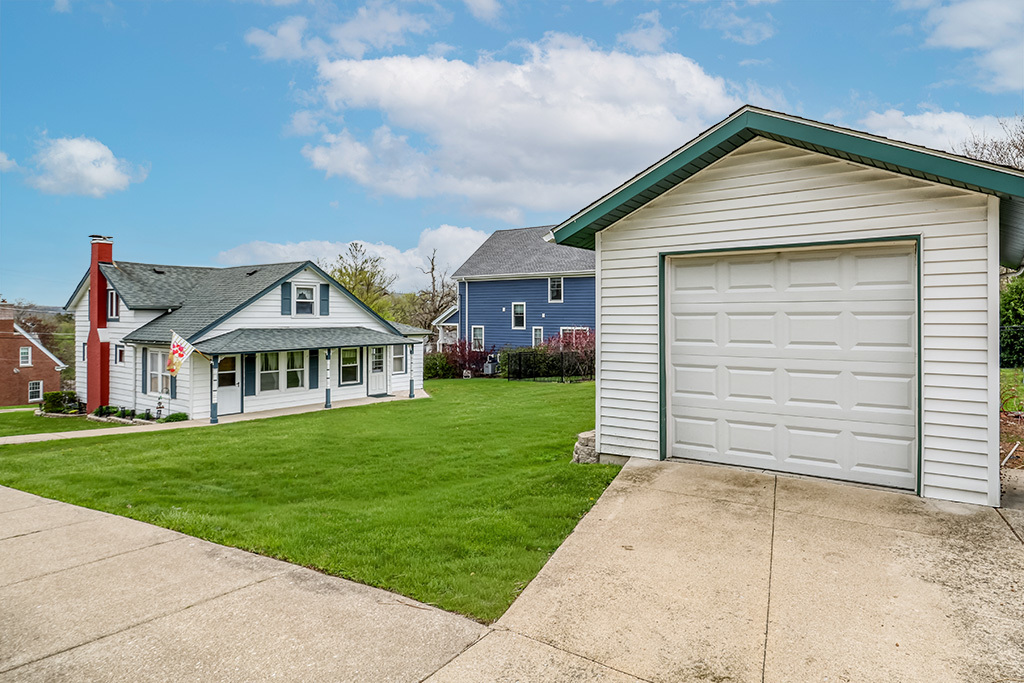 302 East Division Street Lemont, IL 60439 - Photo 10 of 26 a front view of a house with a garden