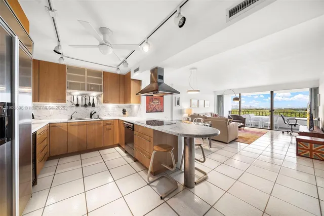 a very nice looking kitchen with a large window