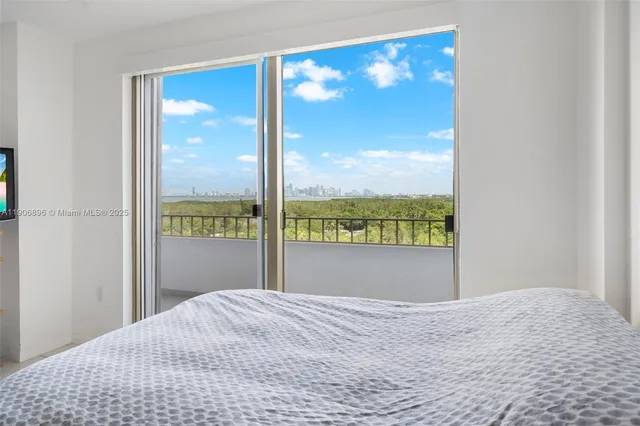 a view of a bedroom with a large window