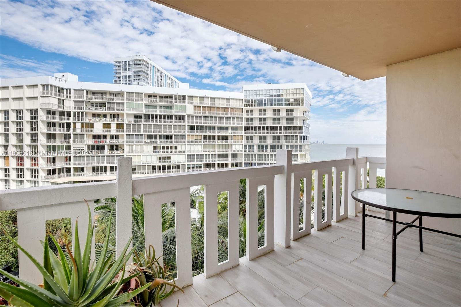1111 Crandon Boulevard, Unit A507 Key Biscayne, FL 33149 - Photo 15 of 23 a view of a balcony with chairs