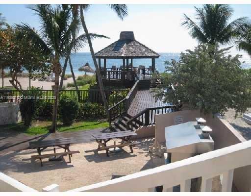 1111 Crandon Boulevard, Unit A507 Key Biscayne, FL 33149 - Photo 19 of 23 a front view of a house with garden