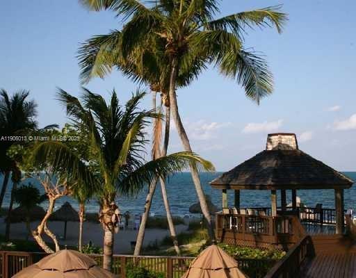 1111 Crandon Boulevard, Unit A507 Key Biscayne, FL 33149 - Photo 20 of 23 a view of outdoor space with swimming pool and furniture