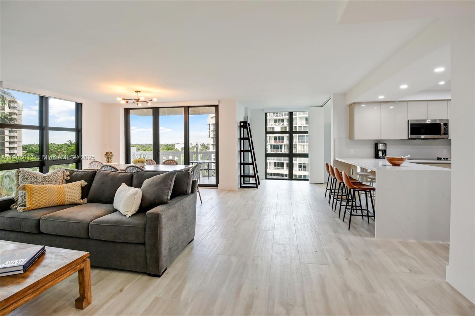 1111 Crandon Boulevard, Unit A507 Key Biscayne, FL 33149 - Photo 2 of 23 a living room with furniture and a wooden floor
