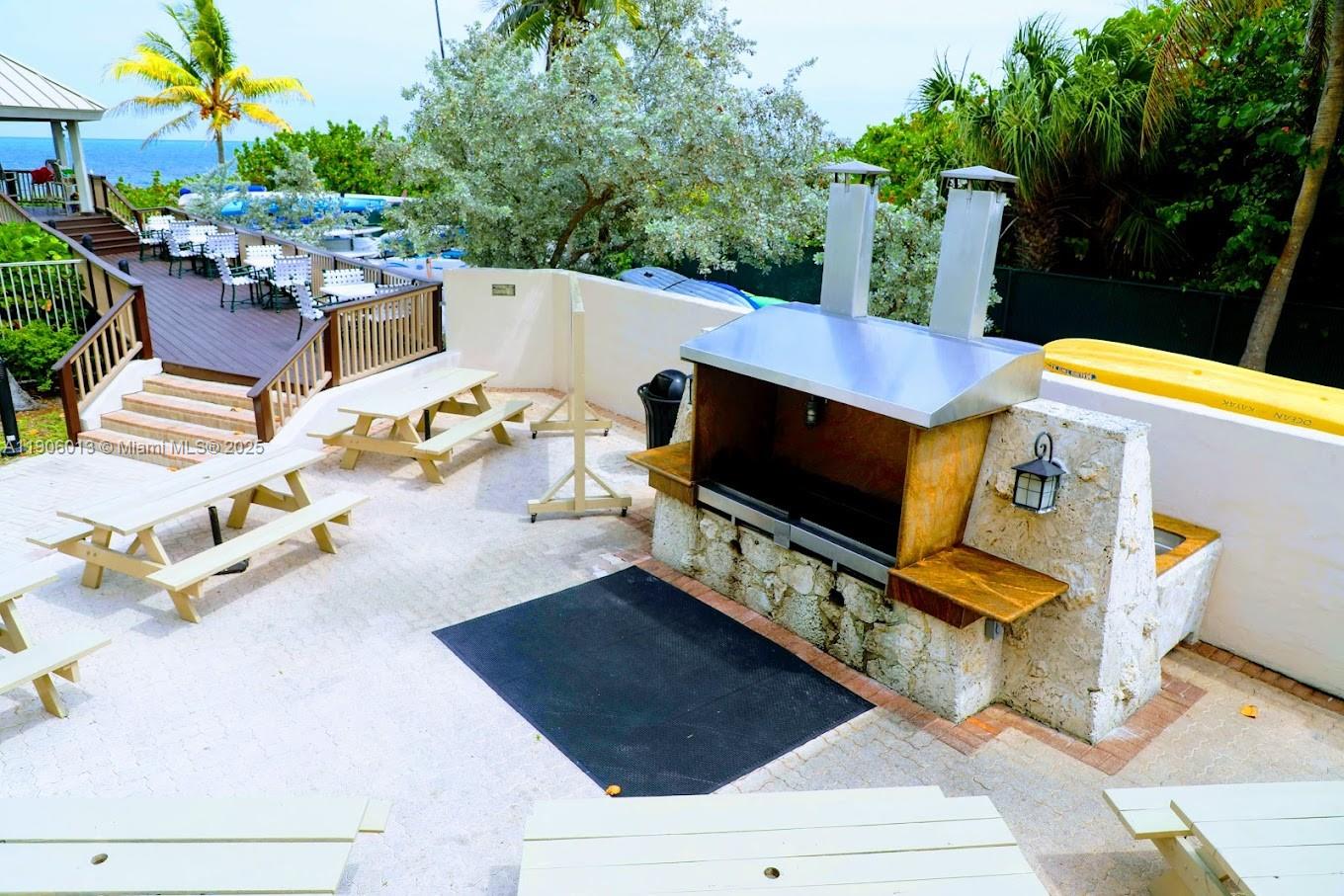 1111 Crandon Boulevard, Unit A507 Key Biscayne, FL 33149 - Photo 22 of 23 an outdoor space with seating area and garden