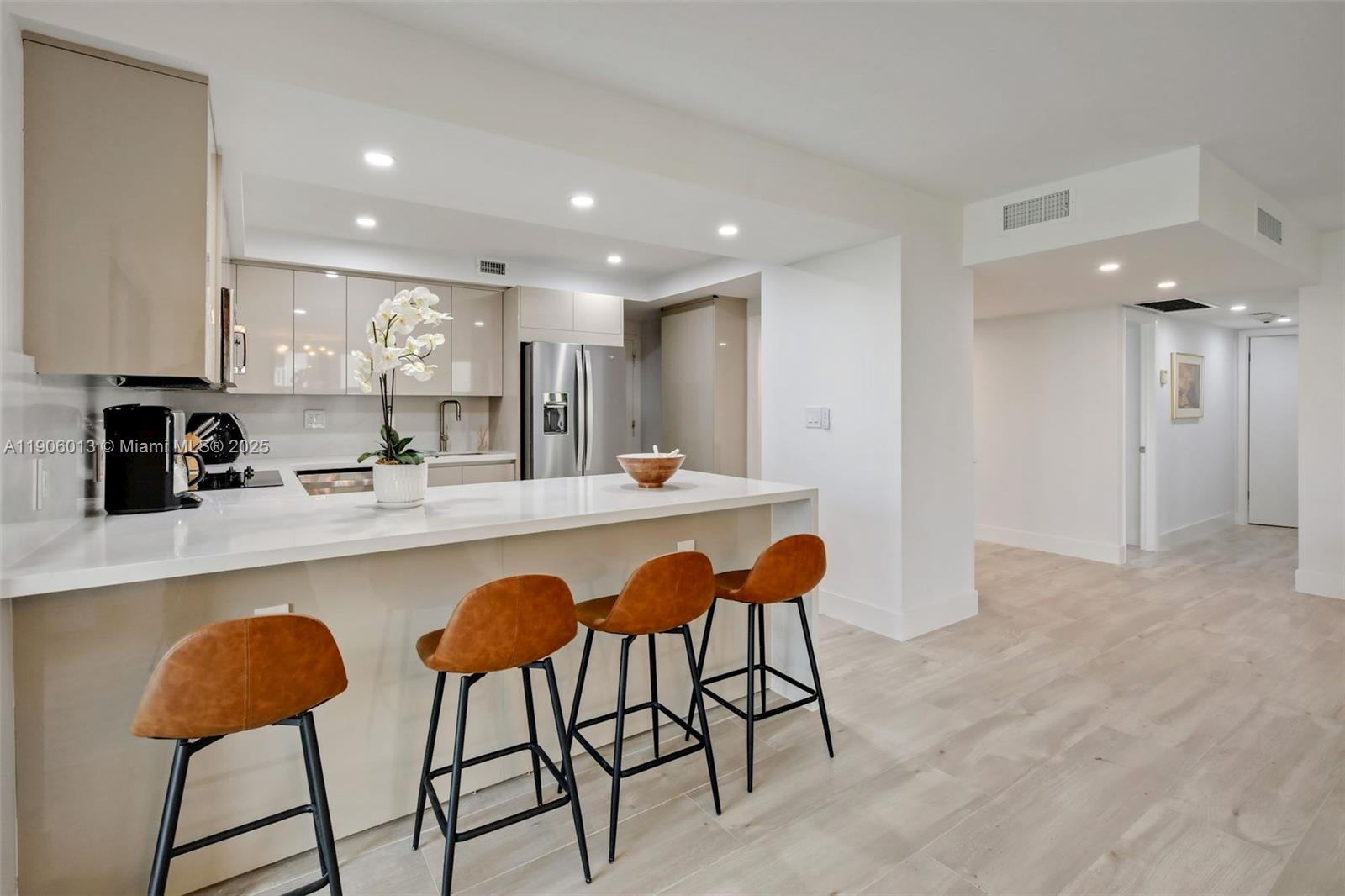 1111 Crandon Boulevard, Unit A507 Key Biscayne, FL 33149 - Photo 5 of 23 a kitchen with stainless steel appliances a sink and a refrigerator