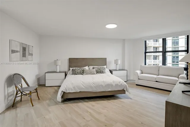 a bedroom with a bed and a couch