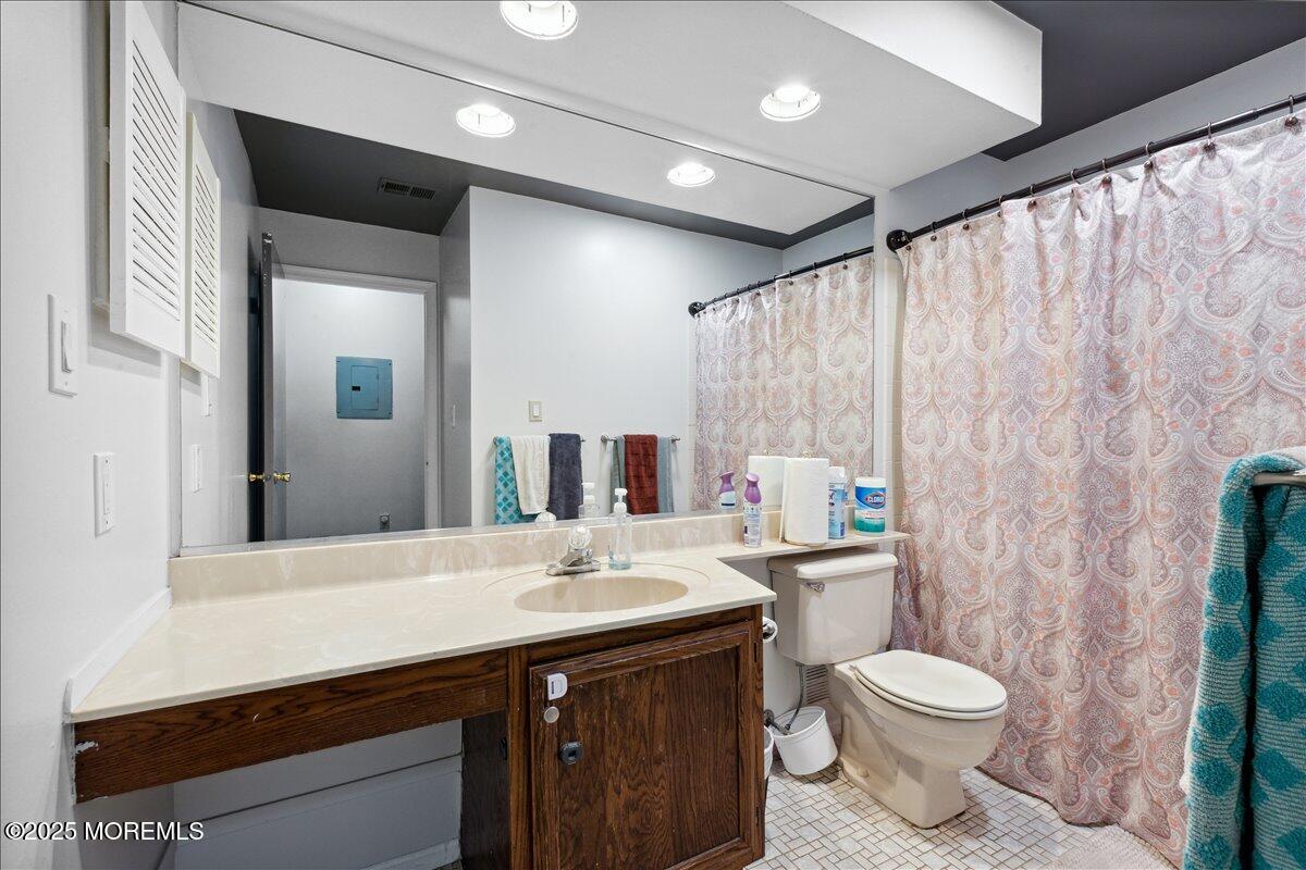 425 Winterberry Court Howell, NJ 07731 - Photo 15 of 17 a bathroom with a double vanity sink toilet and a mirror