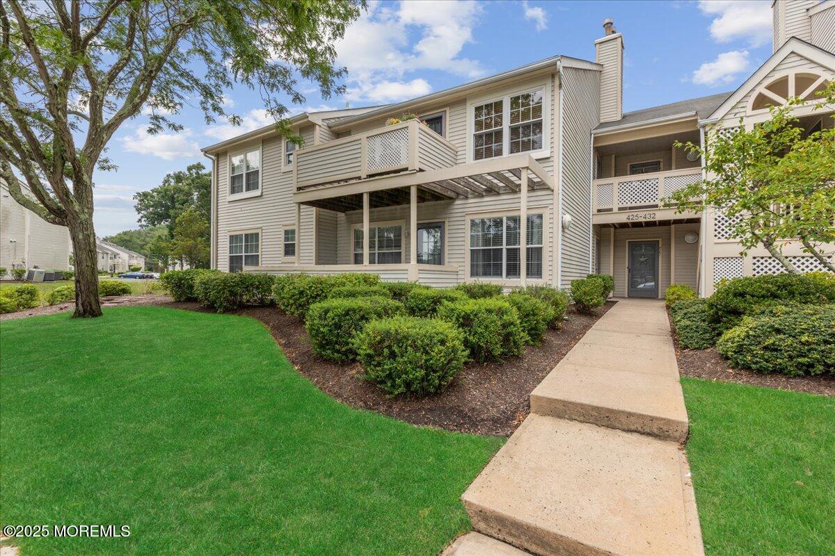 425 Winterberry Court Howell, NJ 07731 - Photo 2 of 17 a front view of a house with a yard