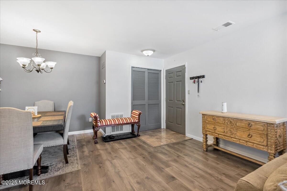 425 Winterberry Court Howell, NJ 07731 - Photo 4 of 17 a living room with furniture and a chandelier