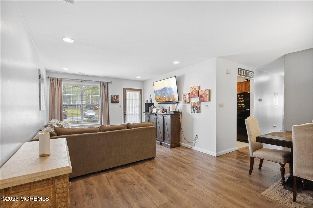 425 Winterberry Court Howell, NJ 07731 - Photo 5 of 17 a living room with furniture and a wooden floor
