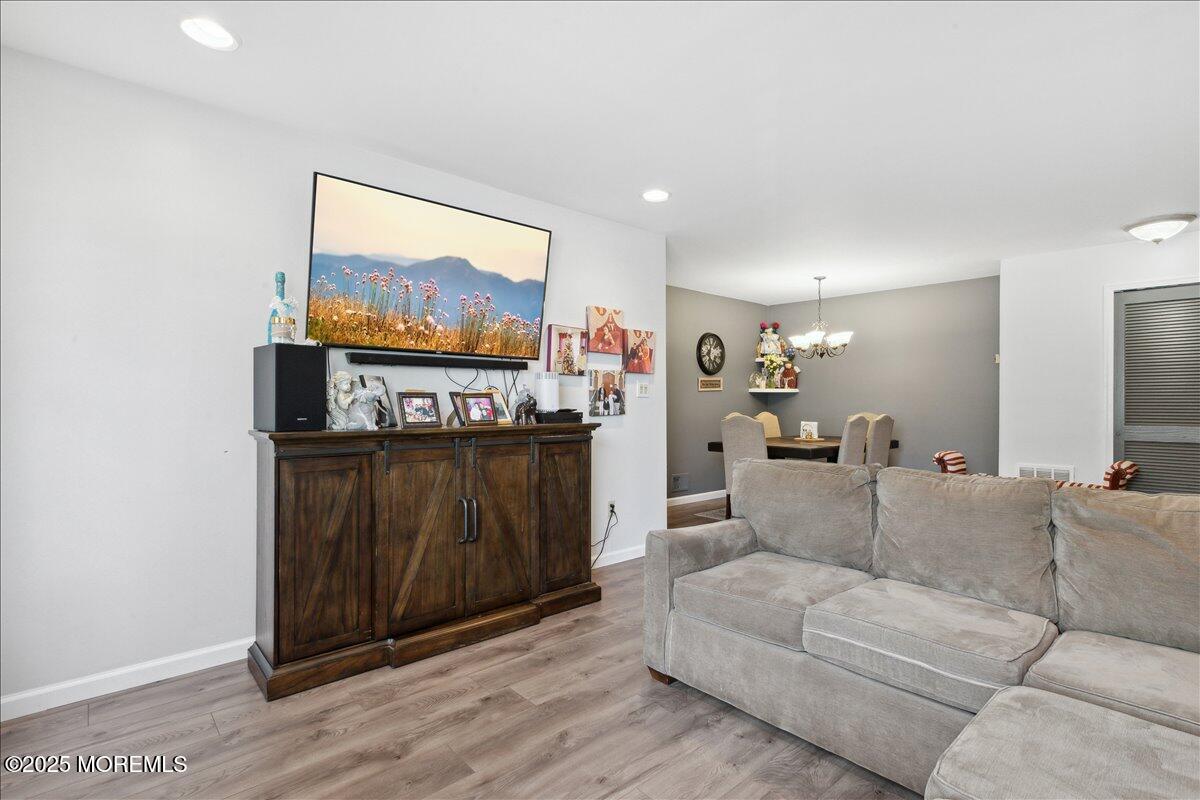 425 Winterberry Court Howell, NJ 07731 - Photo 7 of 17 a living room with furniture and a flat screen tv