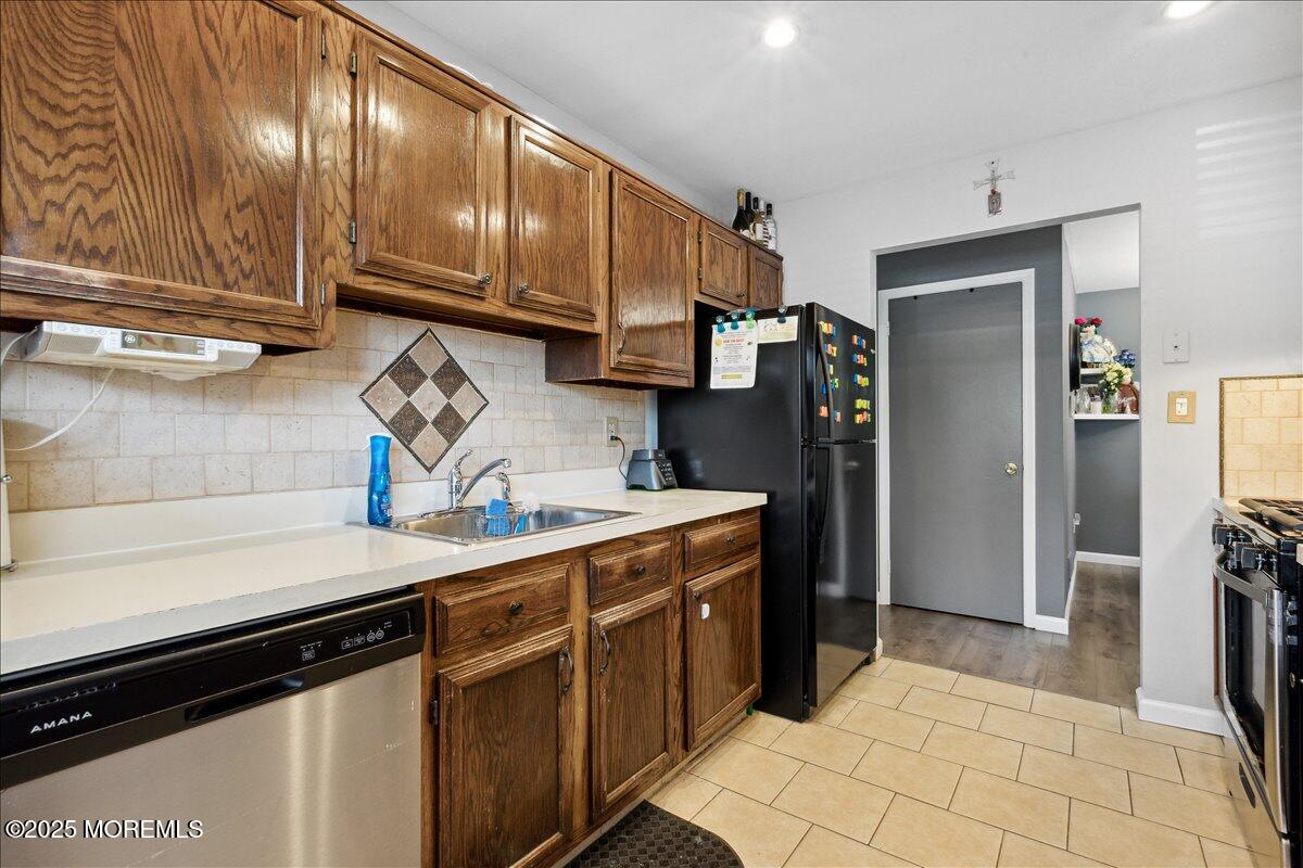 425 Winterberry Court Howell, NJ 07731 - Photo 10 of 17 a kitchen with stainless steel appliances a sink stove and refrigerator