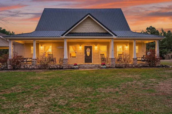 a front view of house with outdoor space and seating