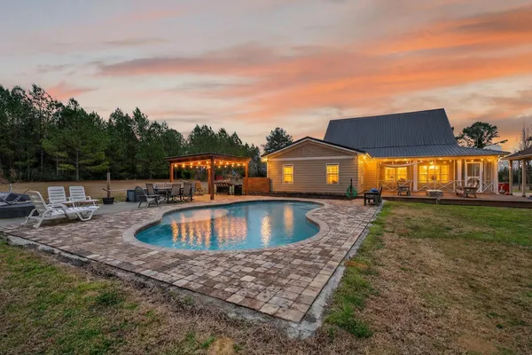 a bed room with a bed and a chair