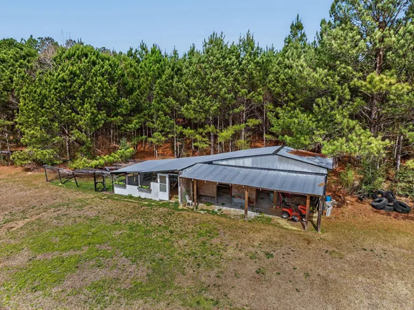 a view of walk in closet with clothes