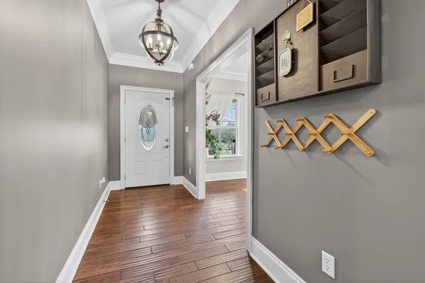 a bathroom with a granite countertop tub sink and mirror