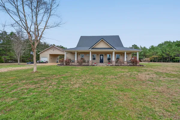 a front view of a house with a yard