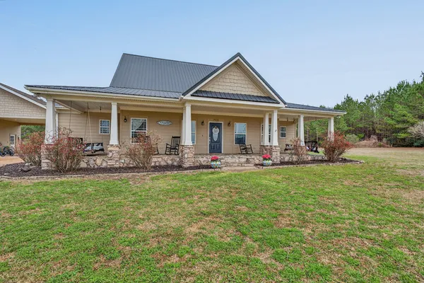 a front view of a house with garden