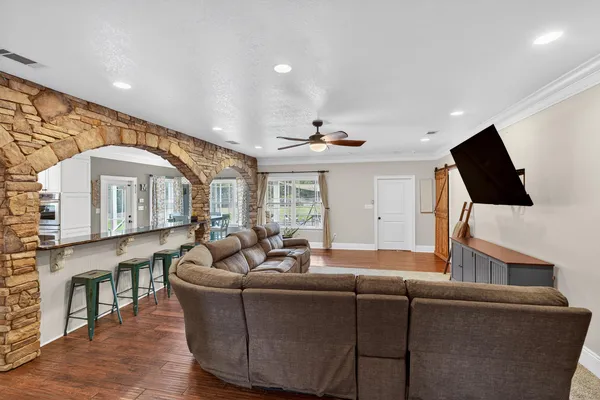 a living room with furniture and a flat screen tv