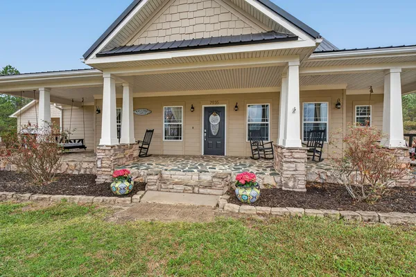 a front view of a house with a porch