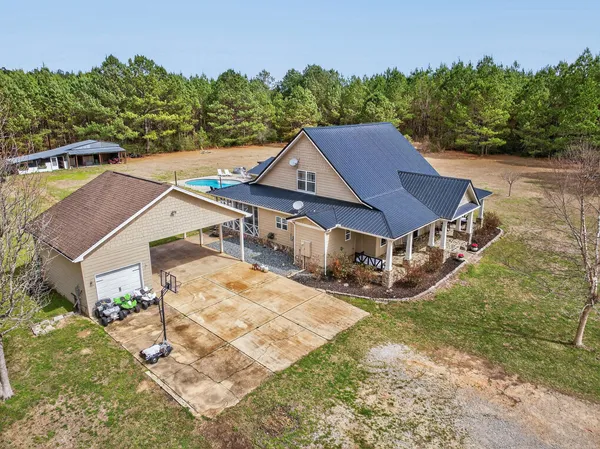 a view of a yard with an outdoor space