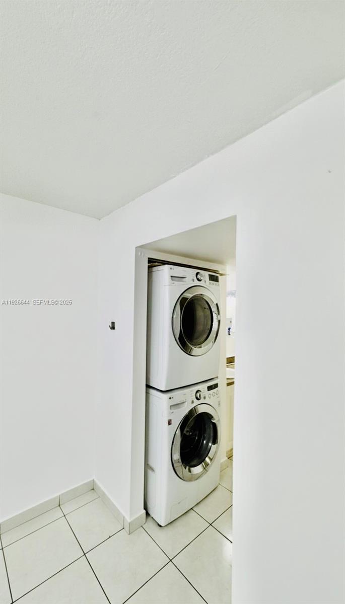 6070 West 19th Avenue, Unit 307 Hialeah, FL 33012 - Photo 13 of 19 a utility room with dryer and washer