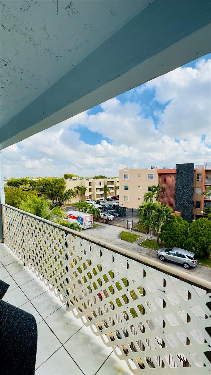 6070 West 19th Avenue, Unit 307 Hialeah, FL 33012 - Photo 18 of 19 a view of city from a balcony