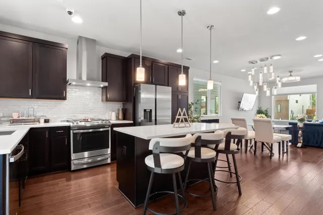 a kitchen with lots of counter space and dining table