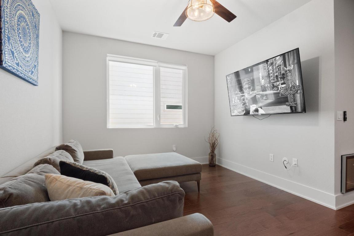7924 Yellow Thistle Trail, Unit 39 Austin, TX 78735 - Photo 14 of 26 a living room with furniture and a window