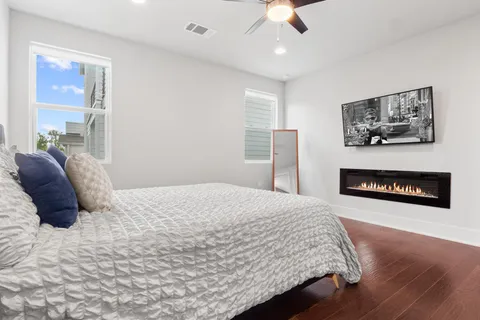 a bedroom with a bed and a fireplace